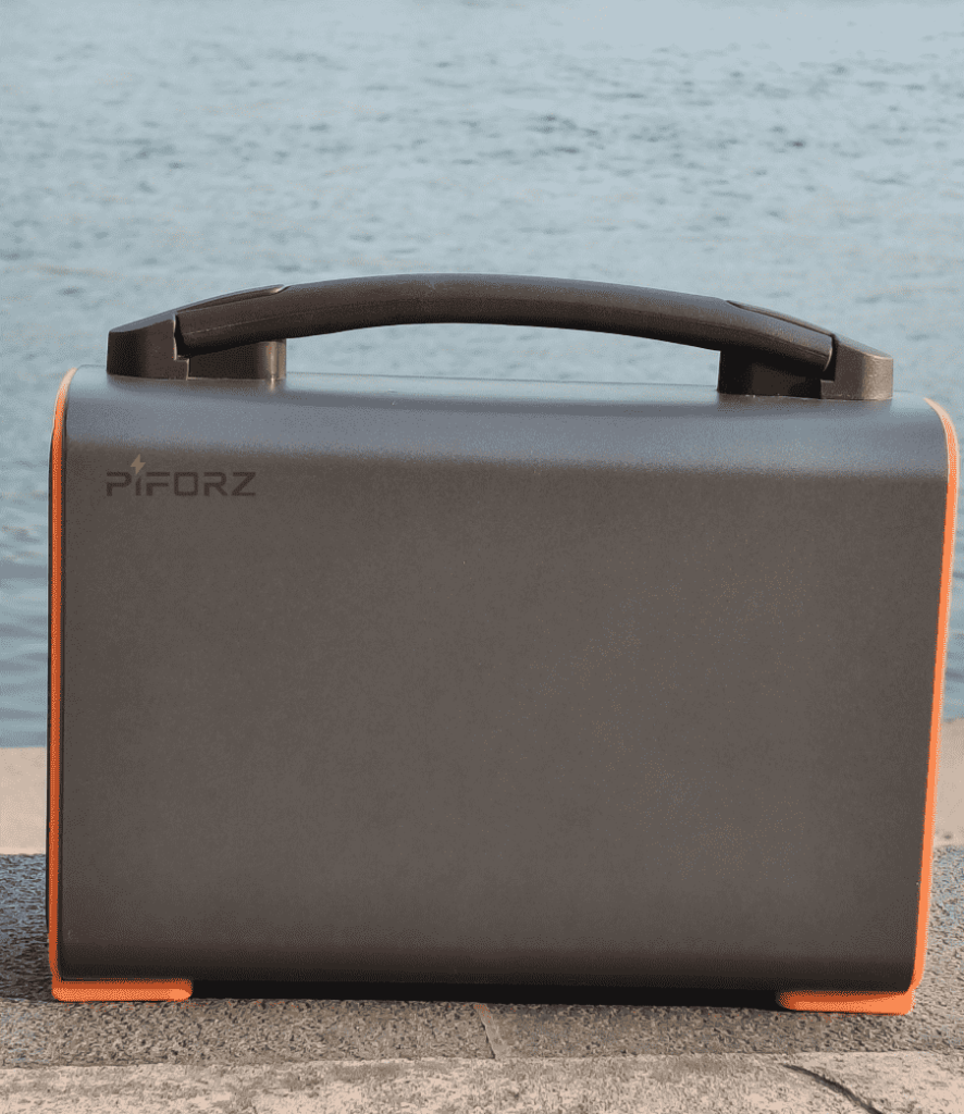 A sleek, gray Piforz portable power station with a sturdy carry handle, designed for easy outdoor portability and one-handed transport