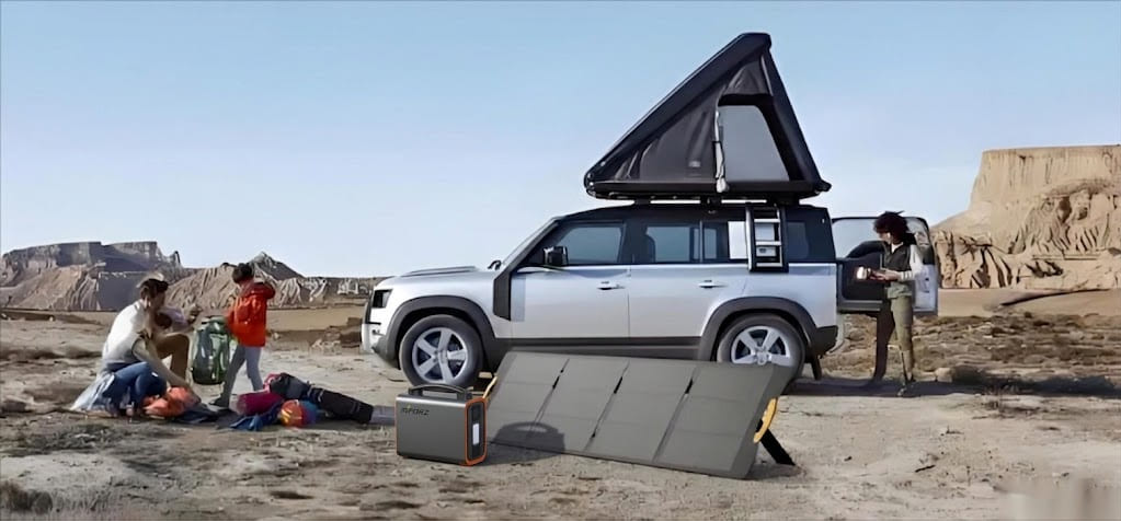 A high-capacity Piforz portable power station plugged into an electric vehicle in a remote area, demonstrating emergency off-grid EV charging capabilities.
