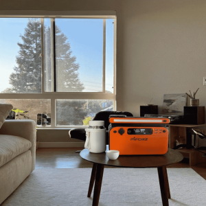 A portable power station for camping used beside an RV to run a coffee maker and small microwave without power drops during off-grid travel.