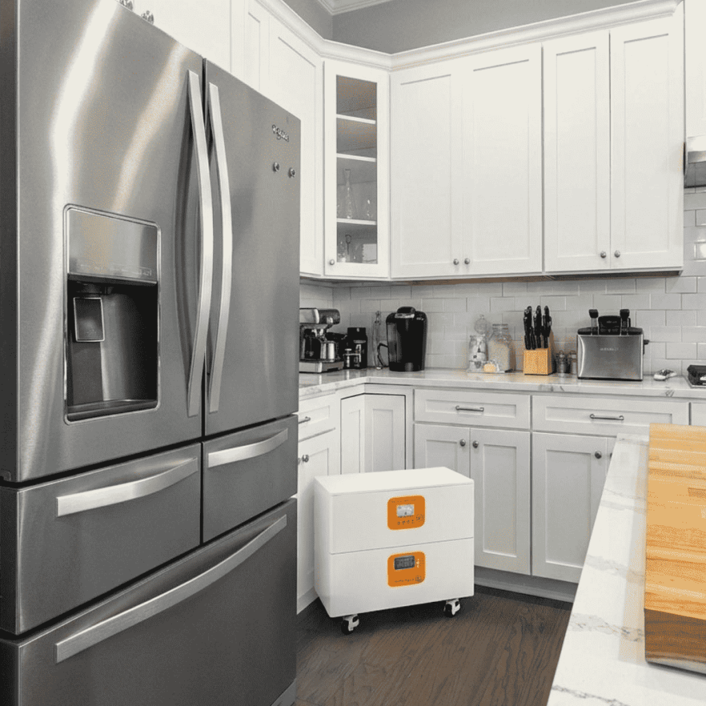 A professional battery backup for appliances showing high wattage output while powering a refrigerator 