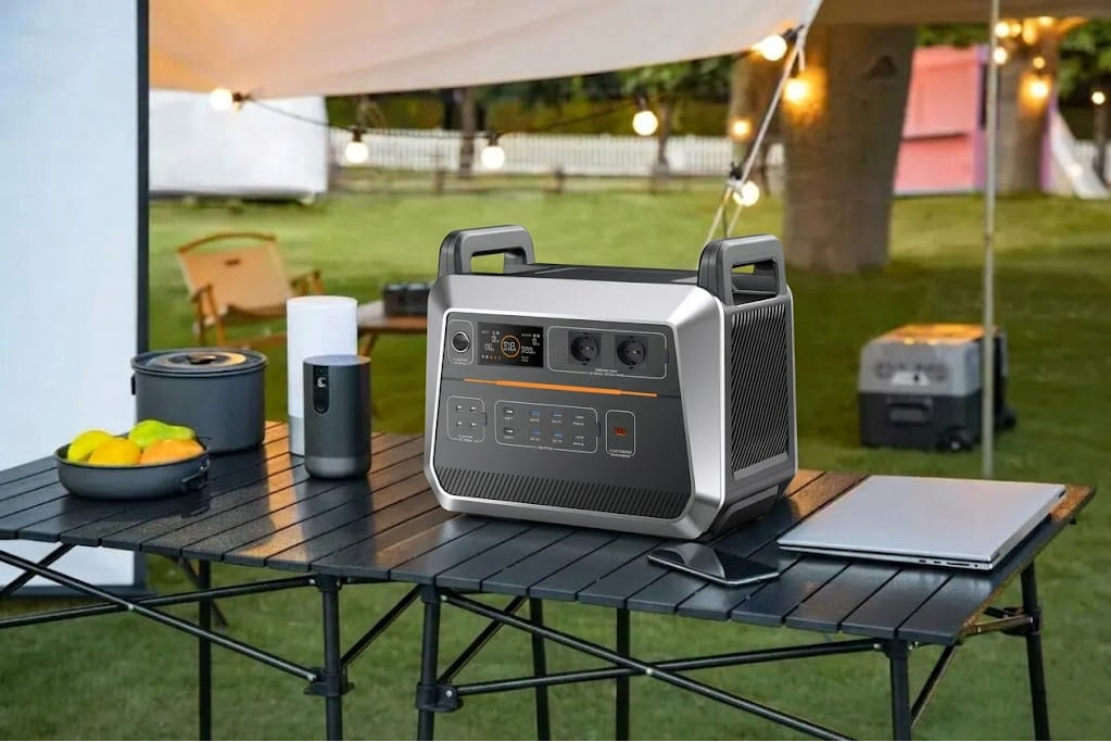 A solar-ready unit, often cited as the best portable generator for the money on a black camping table outdoors, demonstrating its dual-use capability for long-term home backup and off-grid camping. 
