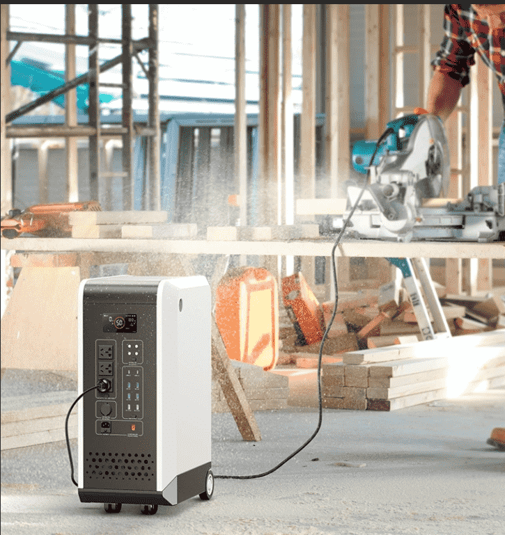 A worker using a circular saw powered by a 3600W portable power station on an outdoor construction site