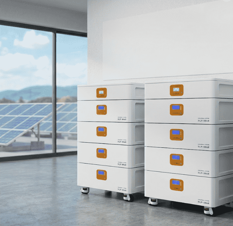 Stacked lithium solar battery backup systems installed inside a home with rooftop solar panels visible outside the window