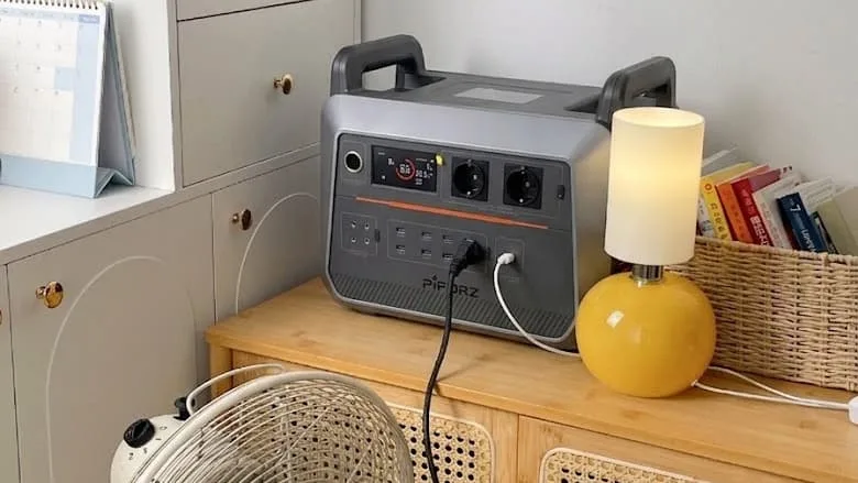 Portable power station charging via a home AC wall outlet