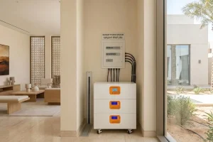Stackable solar energy storage battery installed inside a modern villa as backup power